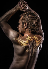 Male model with tribal tattoo, evil, blind, fallen angel of deat
