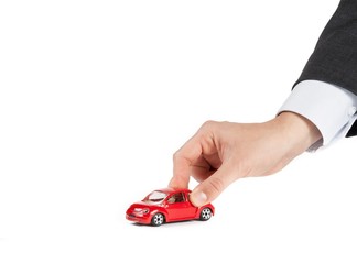 toy car and hand of man, concept for costs