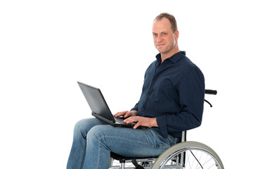 young man in wheelchair working with the computer