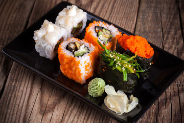 Maki Sushi on wooden background