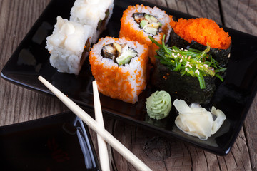 Maki Sushi on wooden background