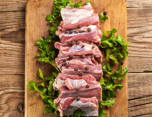 Raw pork ribs on a cutting board