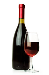 Elegant red wine glass and a wine bottle