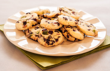 Cranberry cookies on plate and green napkin