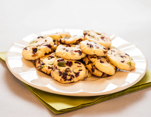 Cranberry cookies on plate and green napkin