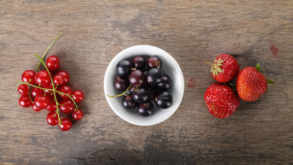 organic garden berries on old wood table