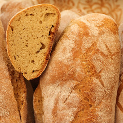 loaves of crispy traditional bread on farmers market