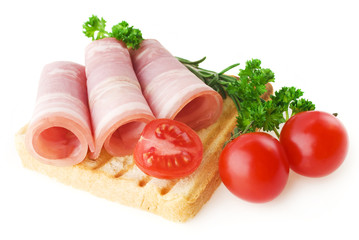 Slices of ham with rosemary