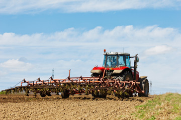 Fototapeta premium Farmer plowing the field
