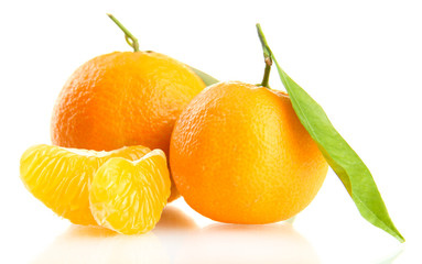 Ripe sweet tangerine with leaves, isolated on white