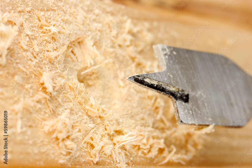 Wall mural Close-up image of drilling hole on wooden plank