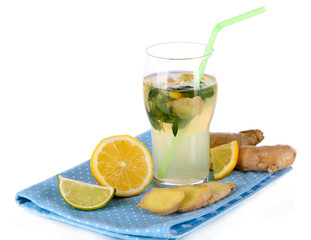 Glass of cold tea with ginger on napkin isolated on white