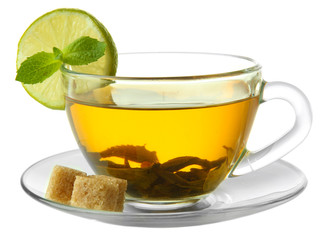 Transparent cup of green tea with lime and sugar isolated