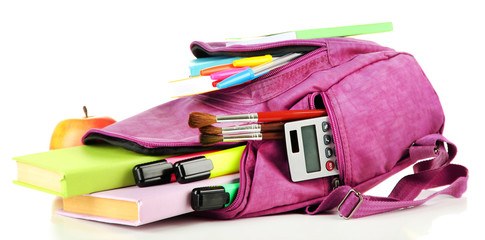 Purple backpack with school supplies isolated on white