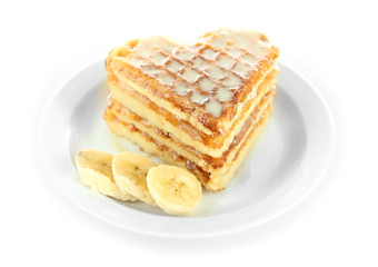 Sweet Belgium waffles with banana, isolated on white