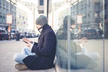 multitasking man using tablet, laptop and cellhpone