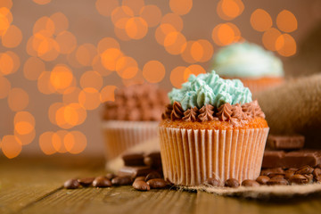 Tasty cupcakes with butter cream,