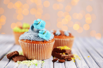 Tasty cupcakes with butter cream,