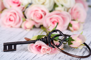 Key of happiness. Conceptual photo. Key with roses,