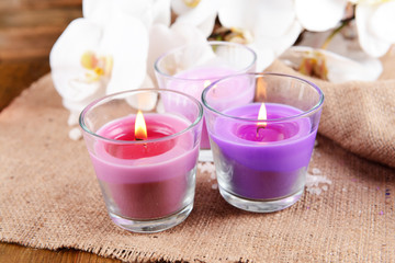 Composition with beautiful colorful candles, sea salt and