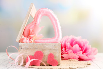 Romantic still life with heart in wooden casket