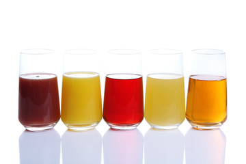 Variety of juices in glasses, isolated on white