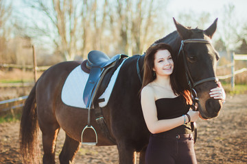 Obraz premium Young woman with a horse on nature