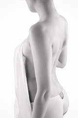 Naklejka premium Young nude woman with towel on white
