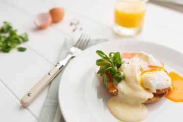 Poached eggs royale with salmon and sauce hollandaise