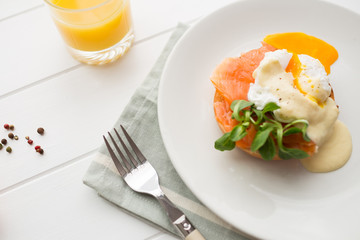 Top view of healthy breakfast with poached eggs royale