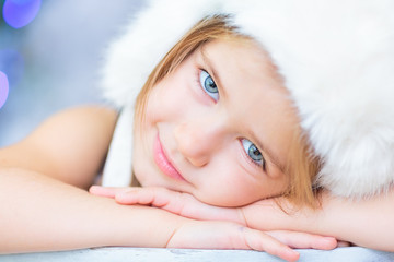 Beautiful little girl with white hat