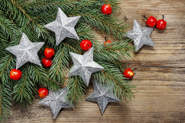 Beautiful christmas background: silver stars and apples on fir