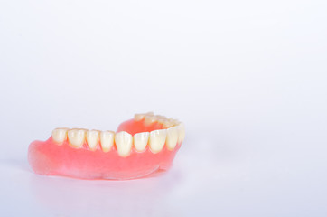 False teeth in glass