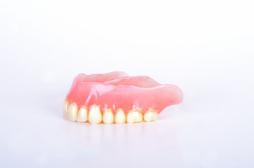 False teeth in glass