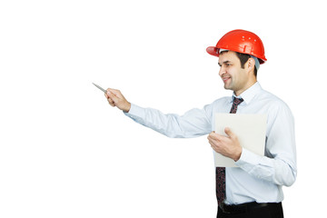 man engineer in a red helmet shows his pen