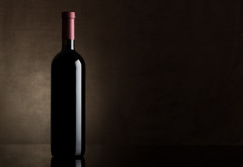 Fototapeta na wymiar Black bottle of dry wine