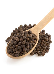 pepper in spoon on white