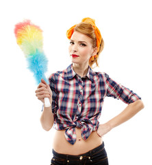Sexy housewife holding a duster