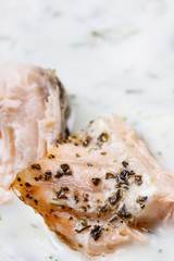Salmon in dill sauce, closeup, selective focus