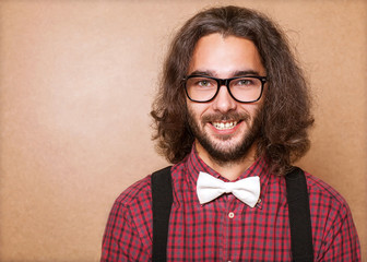 Hipster guy 's clothes in plaid shirt , suspenders and white but