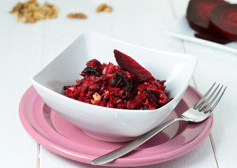 Salad with red beet, dried plums and walnuts