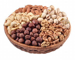 Assorted nuts in a wicker bowl on a white background