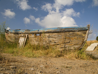 Fototapeta premium Old nautical vessel - abandoned on the dry land