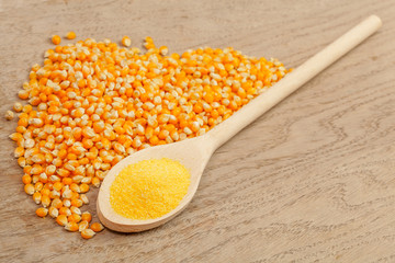Wooden spoon with corn grain