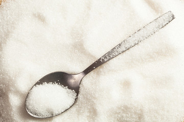 Spoon in a pile of sugar