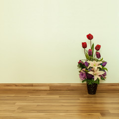 artificial Flowers on Parquet Flooring in room.