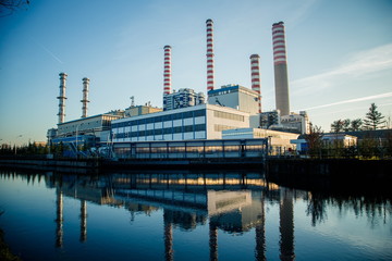 Naklejka premium Electricity power plant near a river