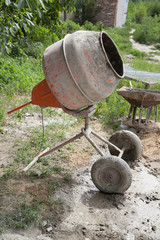 Cement mixer on courtyard with selective focus
