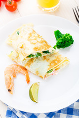 Omelet with shrimps and vegetables