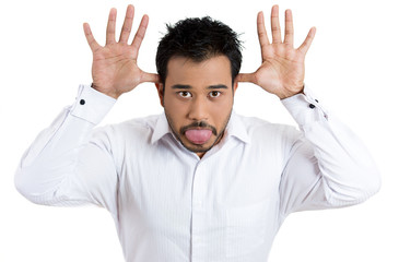 Fototapeta premium Funny, unhappy young man sticking out his tongue